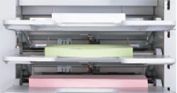 TRAY GUIDES - Self-centering feed guides eliminate the need to reposition on-line bookletmakers for different size stock